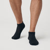 Black Ankle Socks 3-Pack on feet, seamless and moisture-wicking.