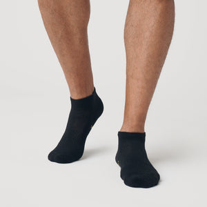 True ClassicBlack Ankle Socks 12-Pack on feet, showcasing seamless toe design.