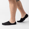 Black Never Show Socks 12-Pack on feet, seamless toe, non-slip design.