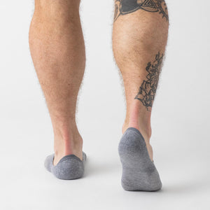 True ClassicPerson wearing Heather Gray Never Show Socks, displaying calf tattoo.