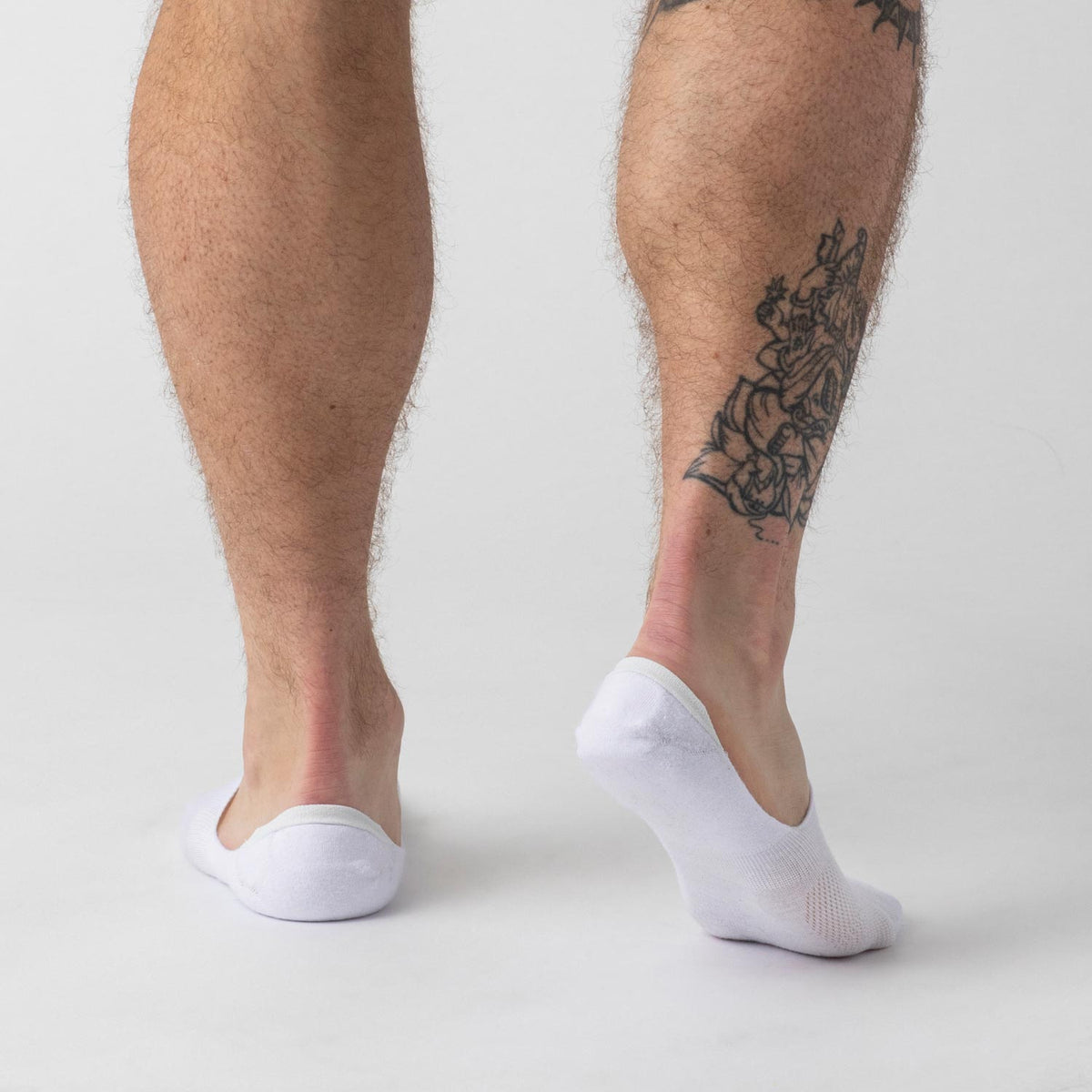 White Never Show Socks 12-Pack on feet, showcasing seamless design and fit.