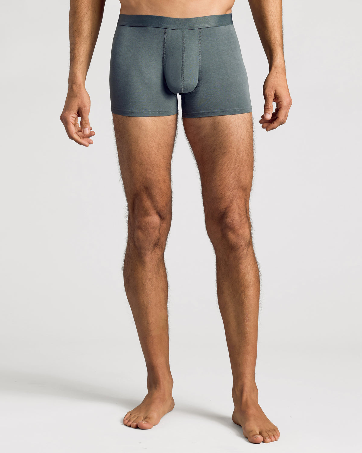 Man wearing Carbon Boxer Trunks, showcasing fit and design.