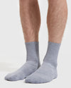 Heather Gray Half Crew Socks on feet, showcasing seamless design and sporty style.