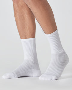 True ClassicWhite Active Crew Socks 3-Pack on lower legs, showcasing athletic fit.