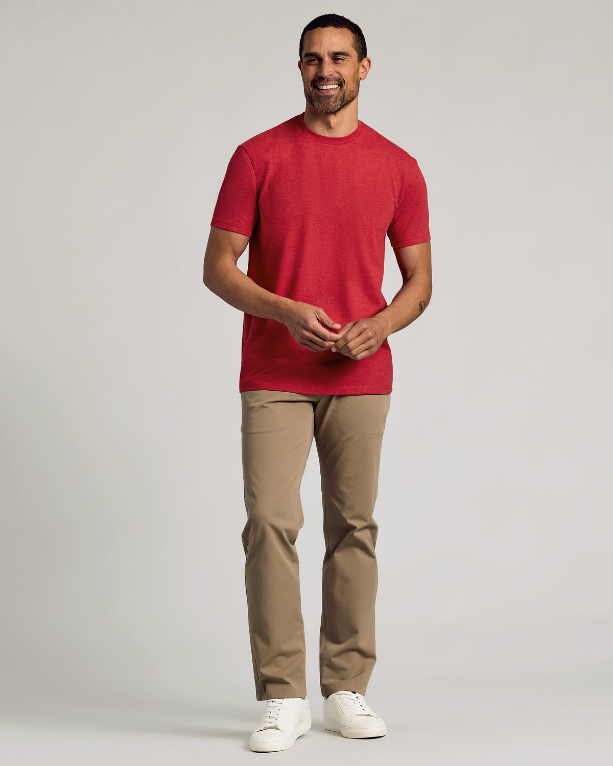 Man wearing Dark Heather Lava Short Sleeve Crew Neck Tee.