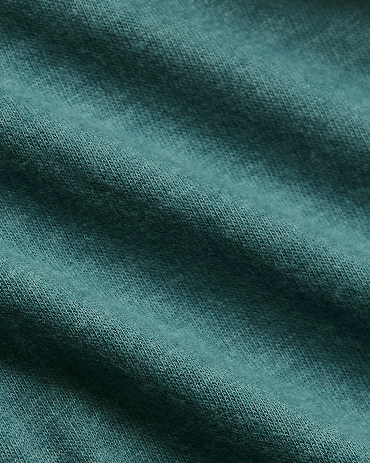 Heather Seafarer Classic Crew Neck with fine knit texture and gentle folds.