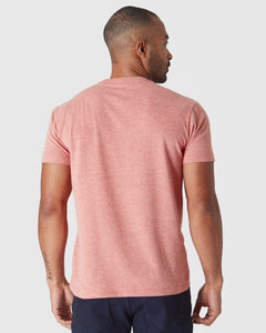 True ClassicMan wearing Heather Cayenne Classic Crew Neck with visible forearm tattoo.