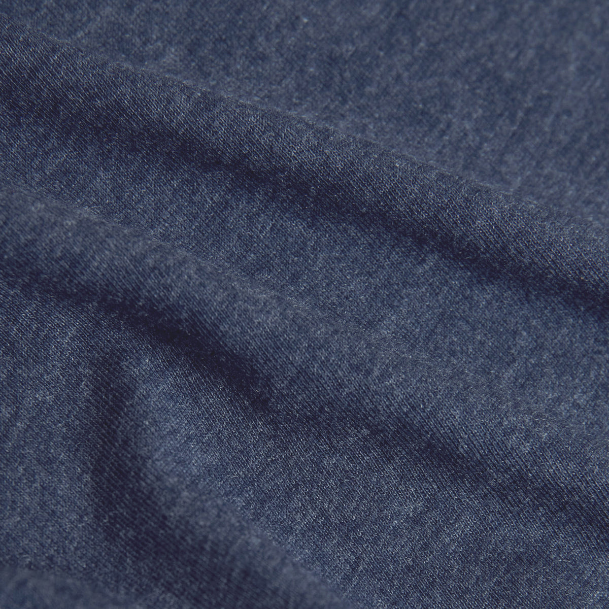 Heather Navy Classic Crew Neck close up showing soft heather navy fabric with a subtle textured weave and tonal variation for mens basics