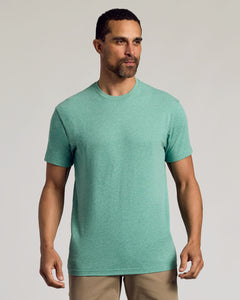 True ClassicMan wearing Light Heather Greenery Classic Crew Neck and tan pants.