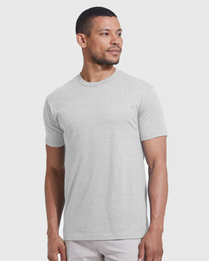 Man wearing Light Heather Gray Classic Crew Neck T-shirt, posed casually.
