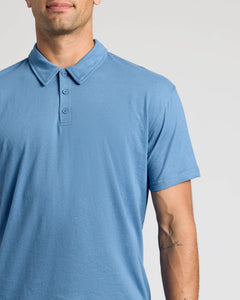 True ClassicPerson wearing Indigo Classic Polo with short sleeves and three-button placket.