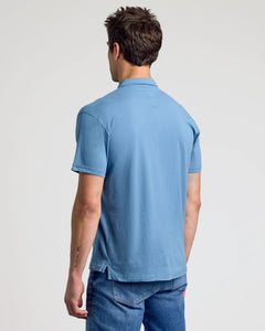 True ClassicBack view of a man in Indigo Classic Polo.