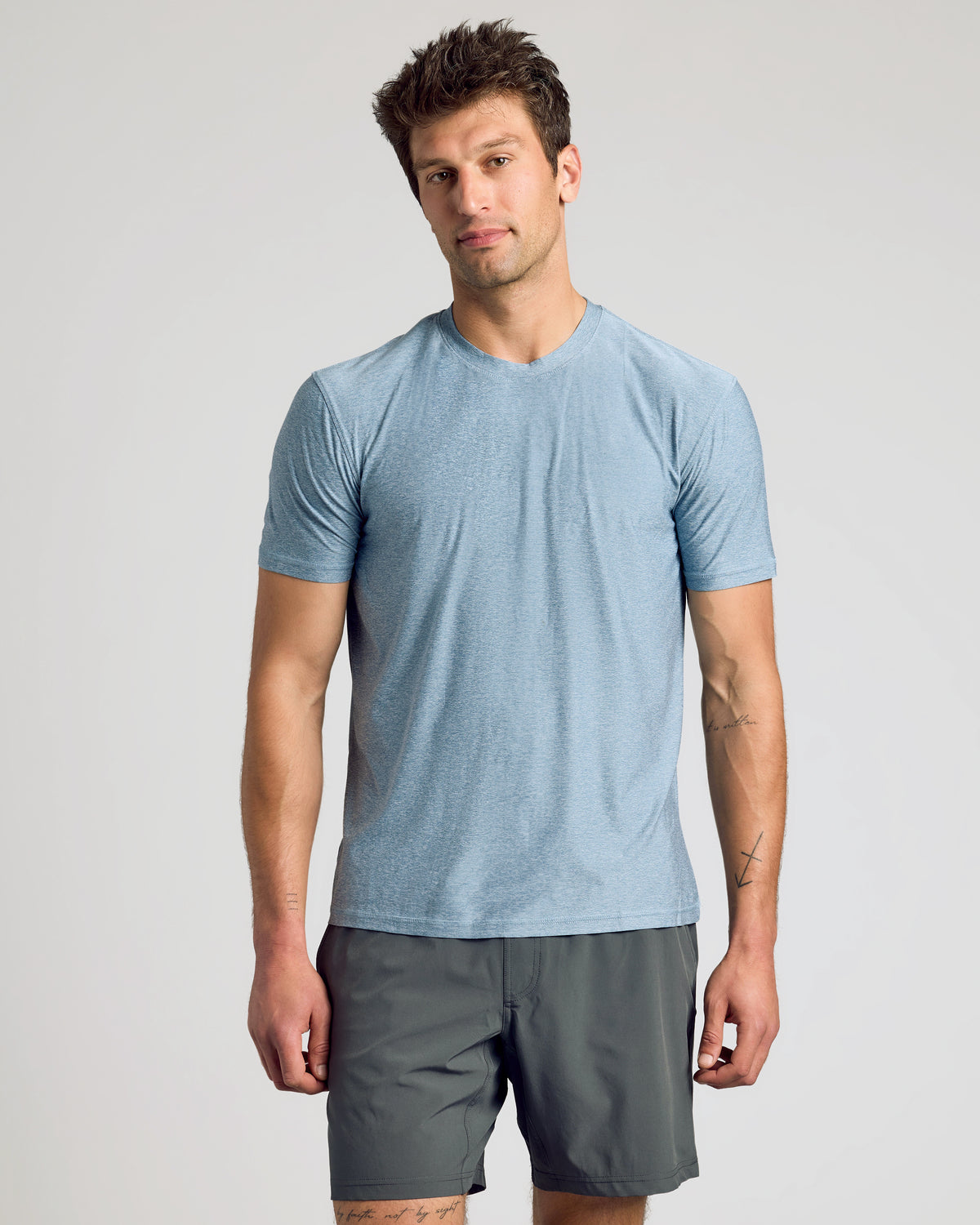 Heather Indigo Active Crew Neck Tee worn by man with tattoos.