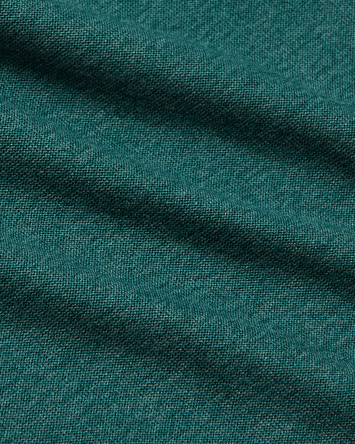 Clover Active Crew Neck Tee's teal-green woven fabric close-up.