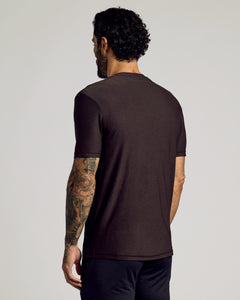 True ClassicMan wearing Dark Heather Cocoa Active Crew Neck Tee, showcasing tattooed arm.