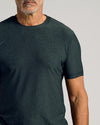 Man wearing Dark Heather Forest Active Short Sleeve Crew Neck Tee.