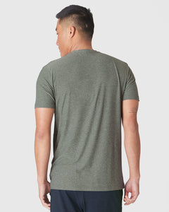 True ClassicHeather Forest Short Sleeve Active Crew Neck worn, showcasing the fit and tattoo.