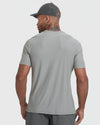 Back view of a man wearing an Iron Gray Active Crew Neck Tee with short sleeves and a gray perforated baseball cap, showcasing the smooth fabric and fit of this men's basics tee.