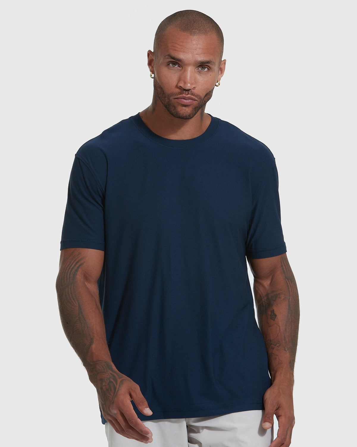 Model in navy tee from The Versatile Crew 9-Pack.
