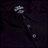 Black Active Polo 2.0 close-up, featuring collar, three-button placket, TRUE CLASSIC label.