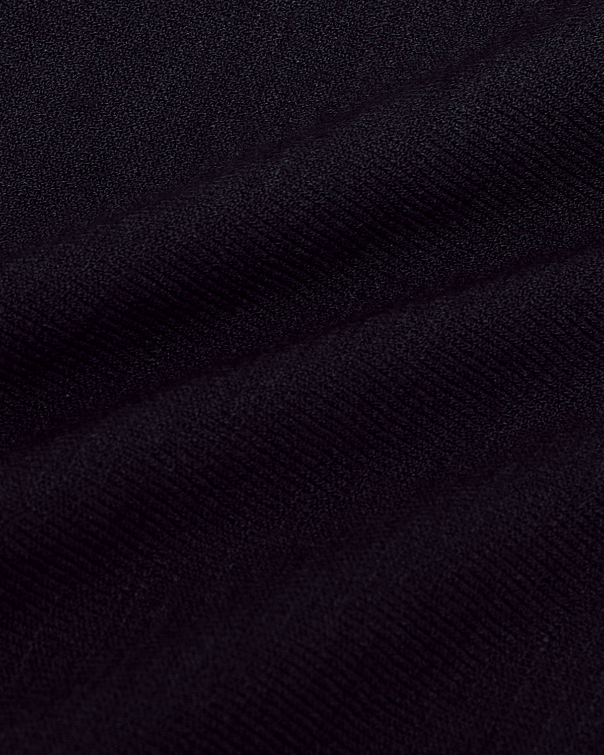 Black Short Sleeve Sweater Polo displaying soft, woven texture and gentle drape.