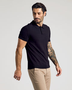 True ClassicBlack Short Sleeve Sweater Polo on tattooed man, relaxed pose.
