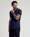 Navy Short Sleeve Sweater Polo worn by tattooed man.