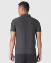 Back view of man in Dark Heather Tempest Active Polo 2.0.