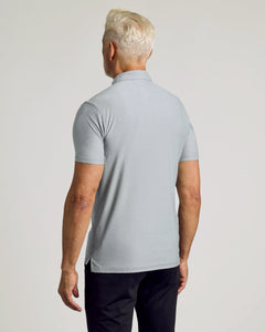 True ClassicMan wearing Heather Light Gray Active Polo, showcasing back view with side hem vent.