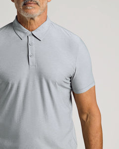 True ClassicHeather Light Gray Active Polo on man with salt-and-pepper beard.