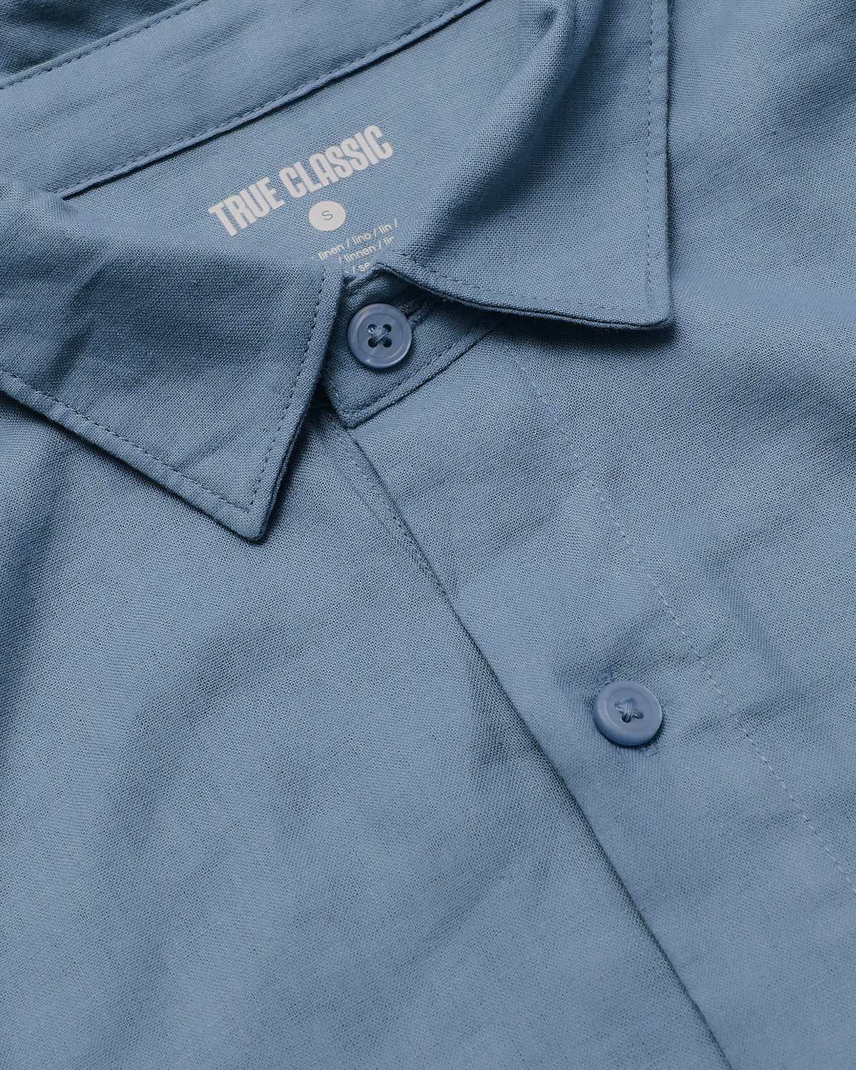 Fiord & Mossy Oak Short Sleeve Linen Shirt, close-up of collar and buttons.