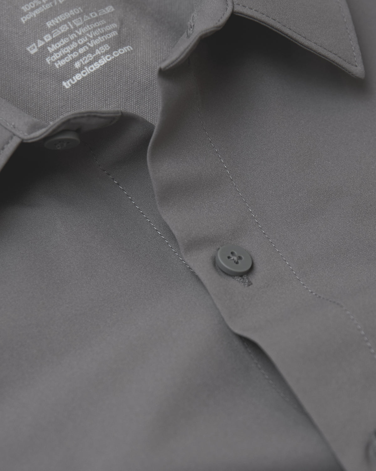 Carbon Commuter Short Sleeve Shirt collar and button details, care tag visible.