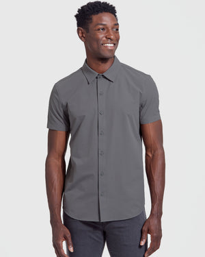 Model in Carbon Commuter Short Sleeve Shirt, slate-gray, smiling slightly.