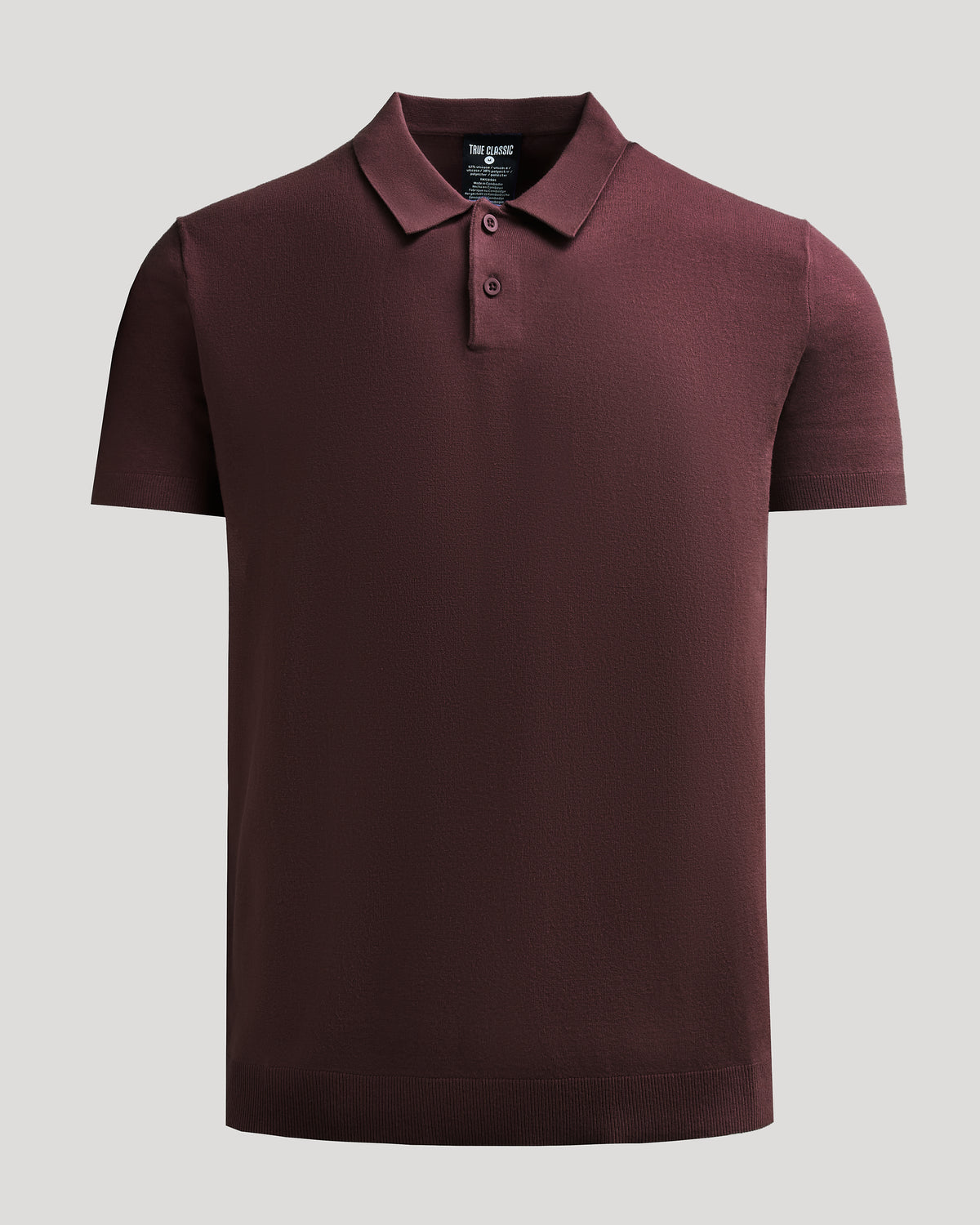 Java Dressy Polo, short-sleeve, with collar buttons, laid flat.