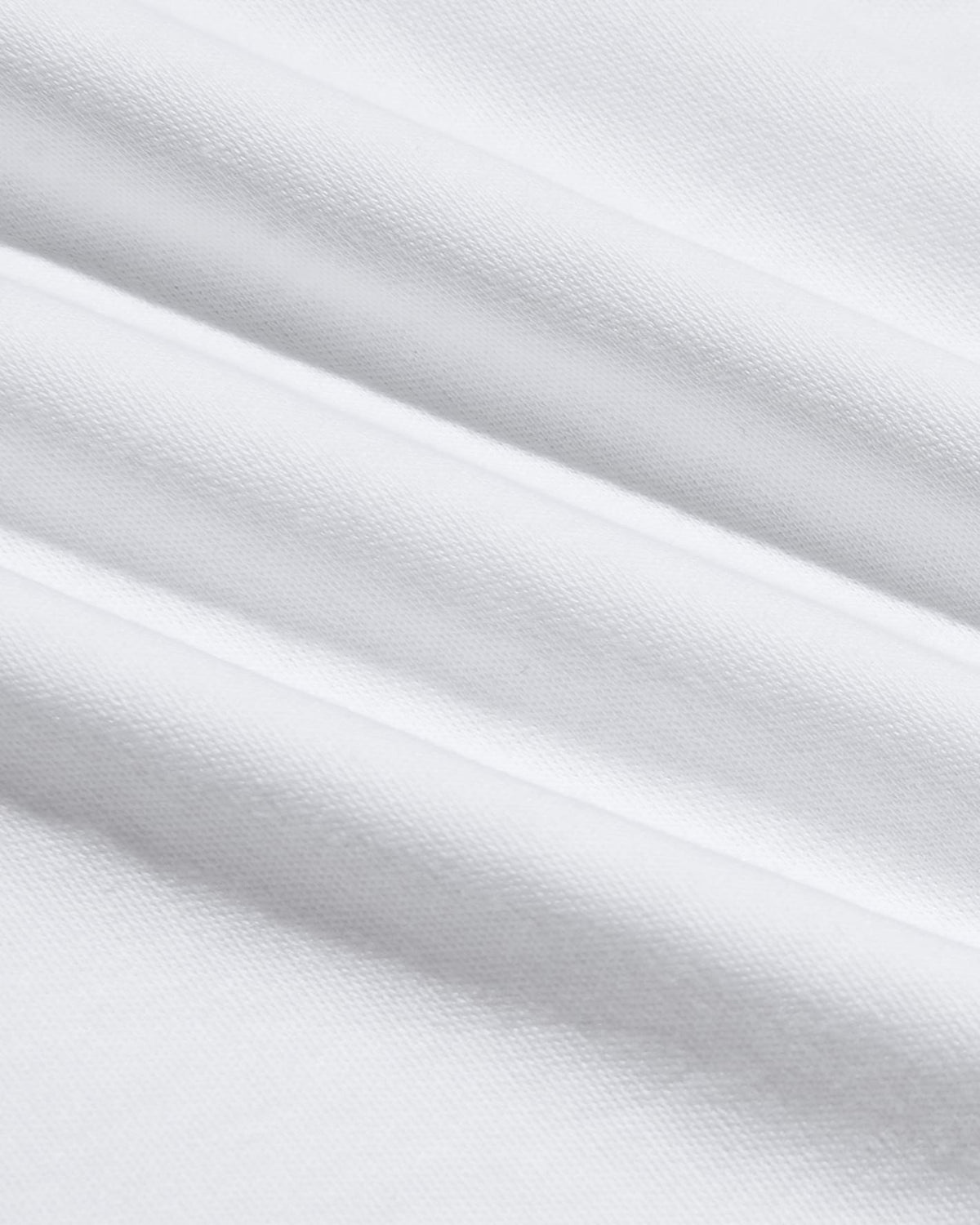Close-up of soft white fabric texture showcasing the smooth, breathable material used in the Pima Cotton Blend Crew 4-Pack men's basics.