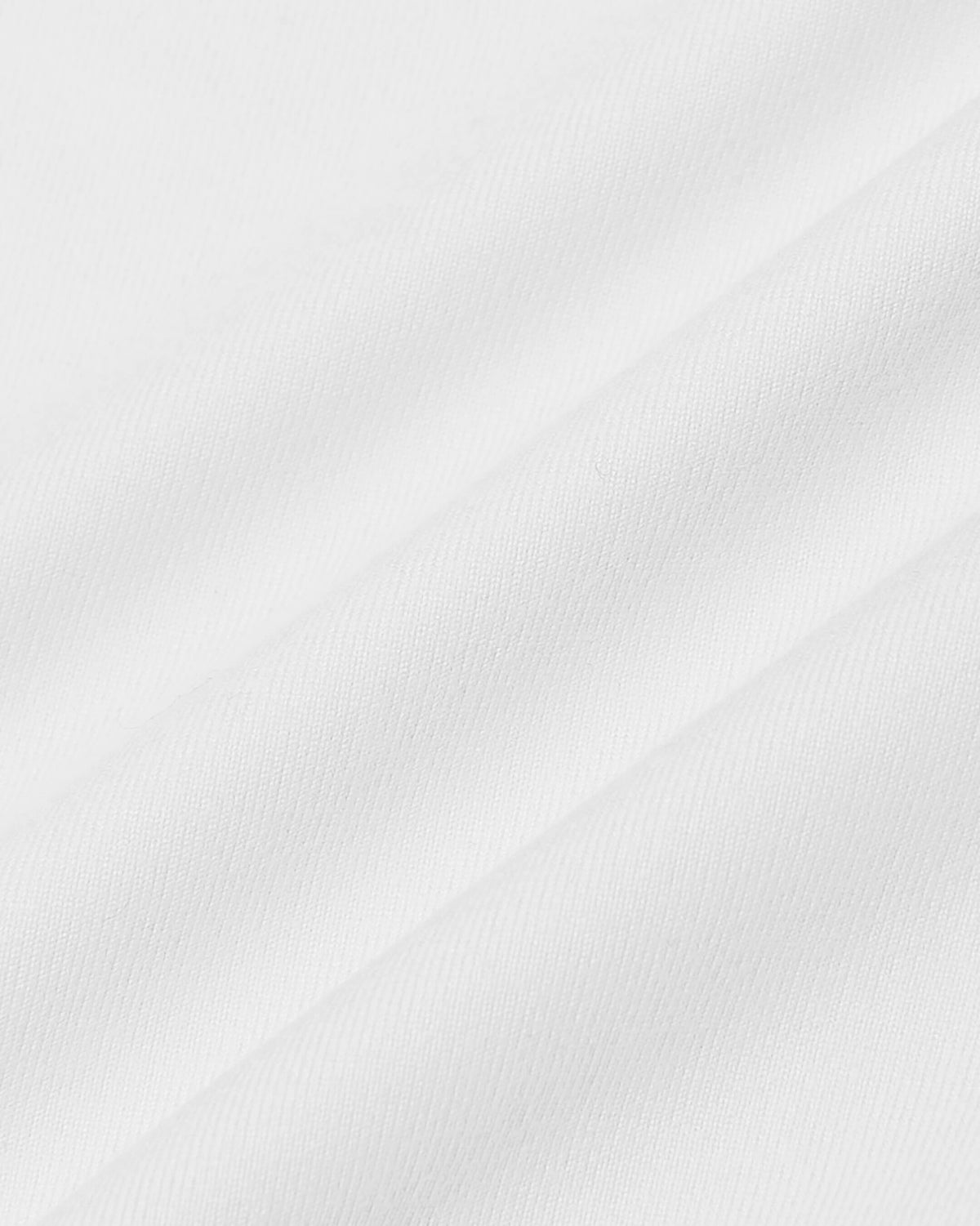 White Short Sleeve Comfort Knit Shirt with fine woven texture and soft drapes.