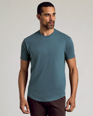 Man wearing Seasonal Classic Curved Hem Crew Neck tee.