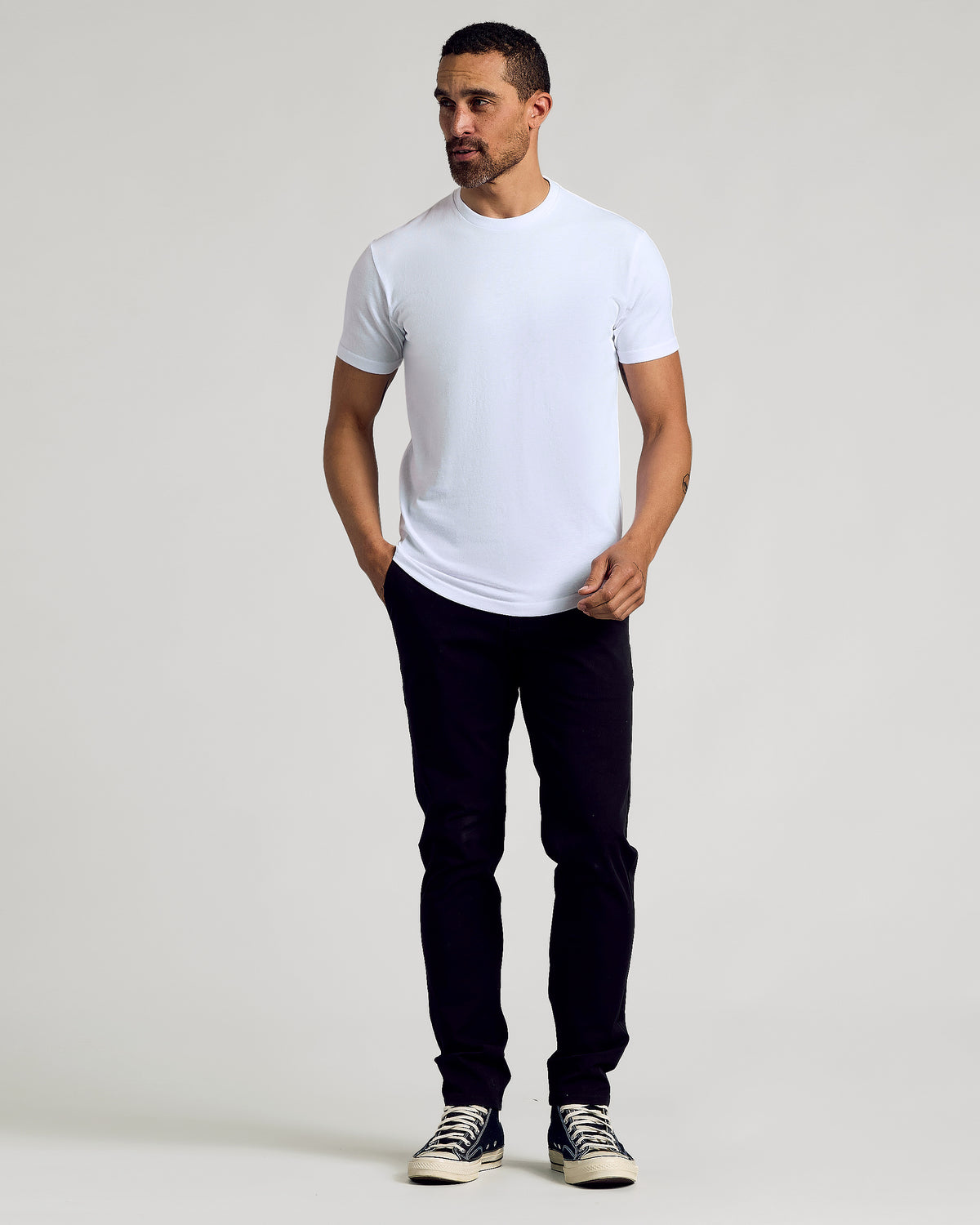 Man wearing Black & White Curved Hem Classic Crew Neck T-shirt.