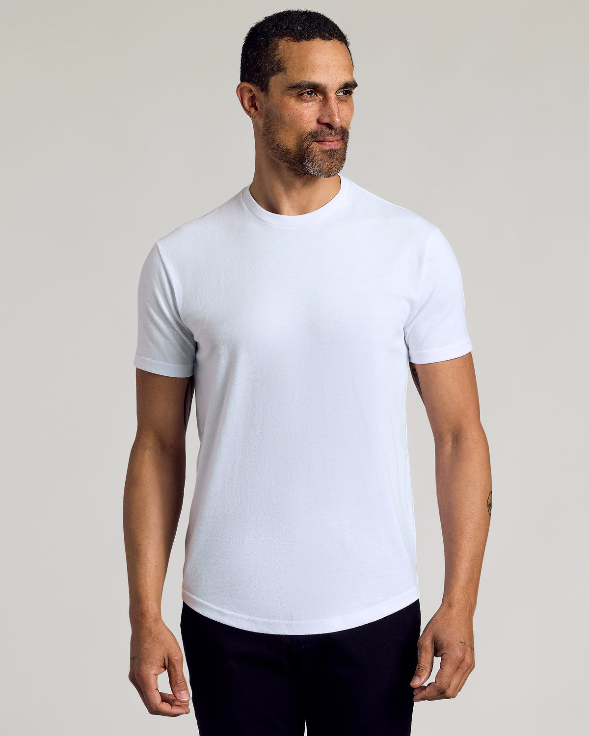 Man in All White Curved Hem Classic Crew Neck T-shirt.