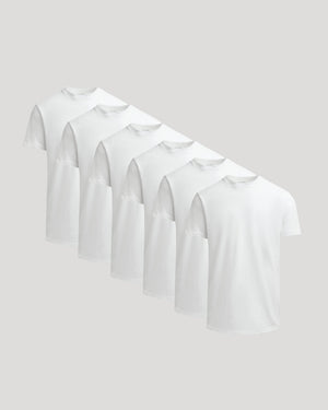Six plain white crew neck t-shirts displayed side by side showcasing the True Classic Men's Heavyweight Curved Hem Crew – Premium Heavyweight Cotton Blend, Modern Athletic Fit, Structured Everyday T-Shirt in men's basics.