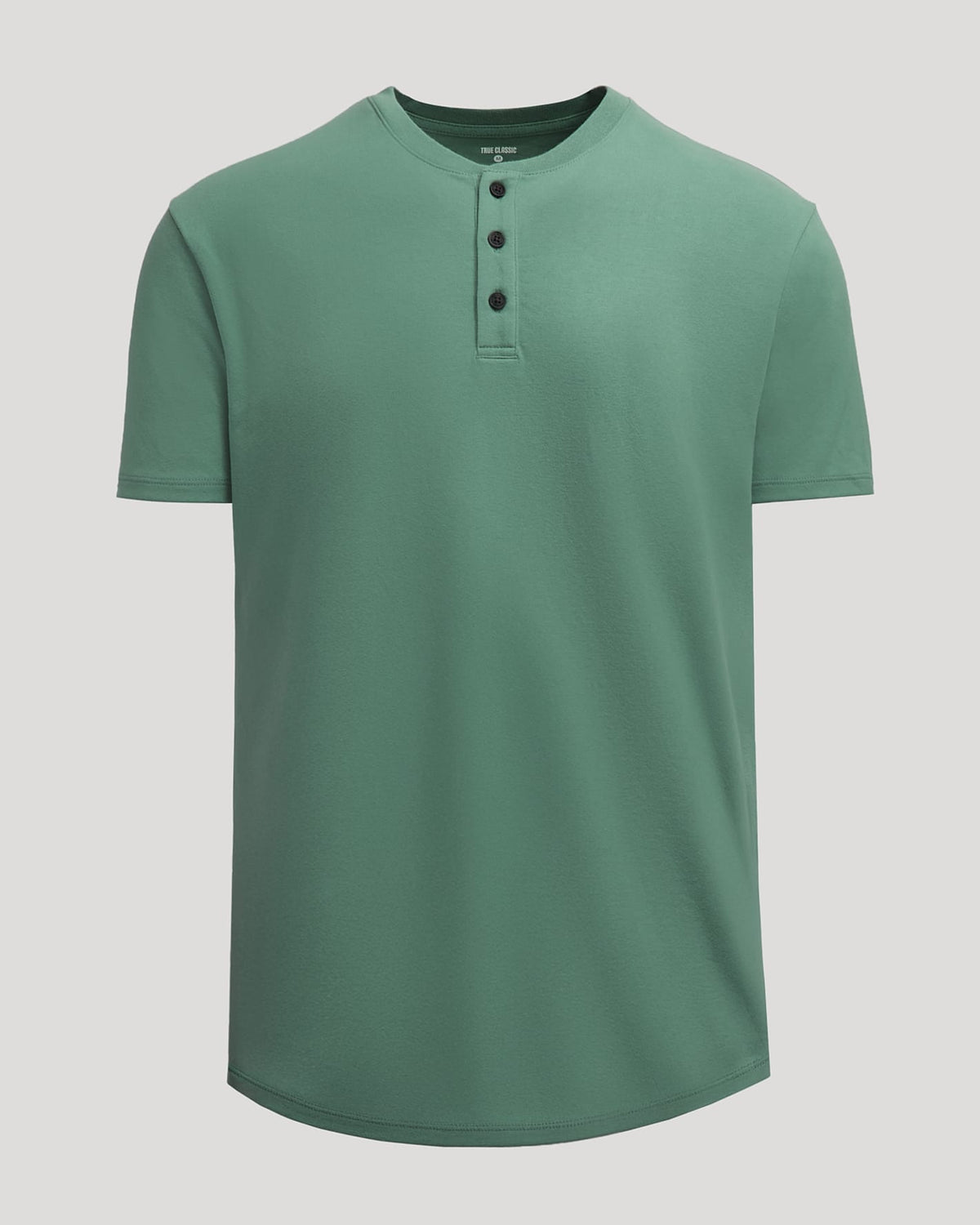 Neo Fern Heavyweight Curved Hem Henley shirt in muted green with short sleeves and a three-button placket, designed as a men's basic with a relaxed fit.