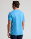 Man wearing Dark Heather Bahama Blue Classic V-Neck from behind.