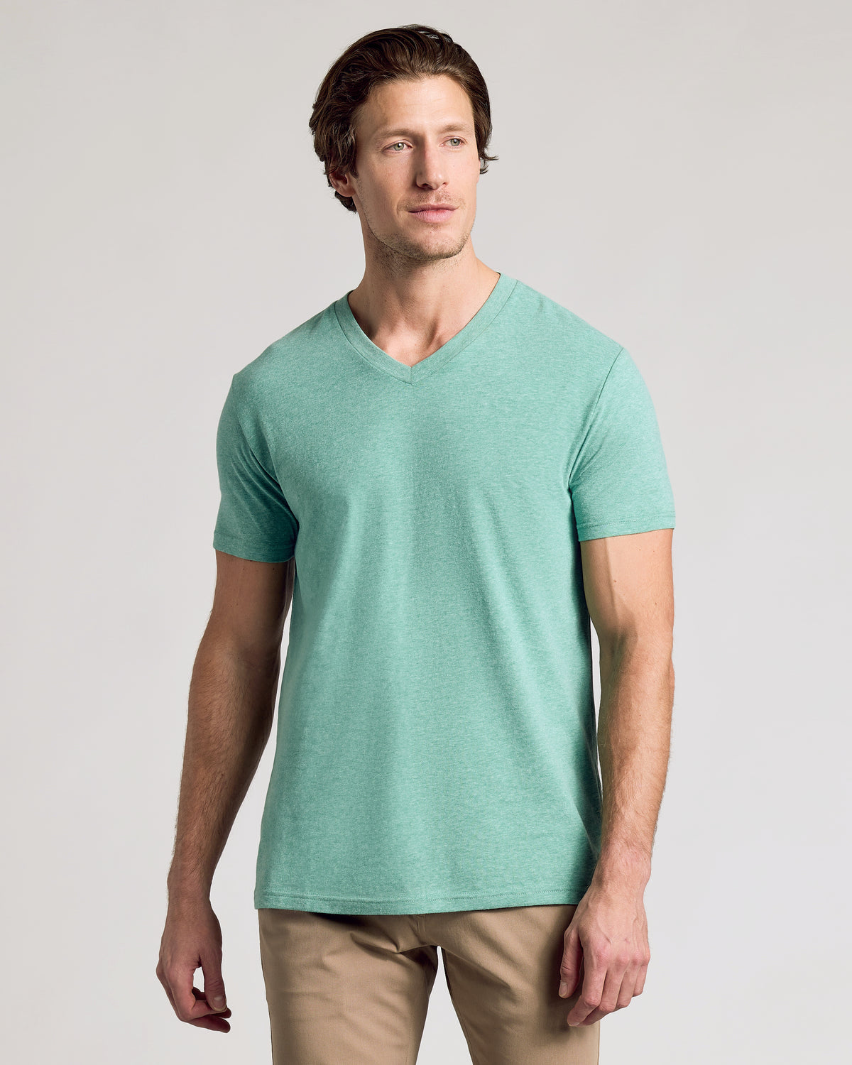 Model in Light Heather Greenery Classic V-Neck, showcasing fit and style.