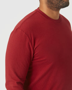 True ClassicClose-up of a man wearing a Crimson Long Sleeve Crew Neck shirt in a rich red hue, showcasing soft fabric and classic men's basics style.