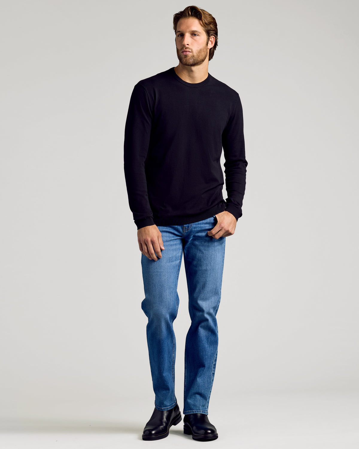 Black Crew Neck Sweater 2-Pack worn with jeans and boots.