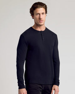 True ClassicYoung man wearing All Black Classic Henley 6-Pack, relaxed pose.