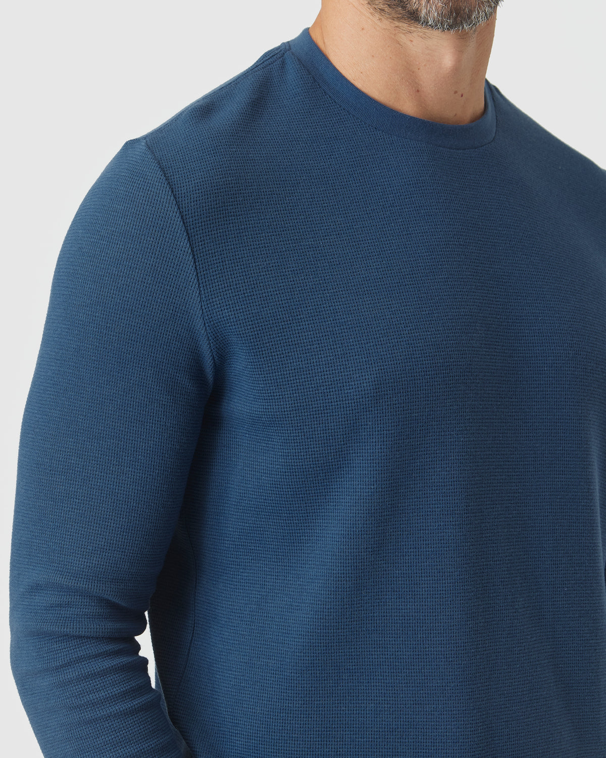 Deep Sea Blue Long Sleeve Waffle Crew on model, showcasing textured fabric.