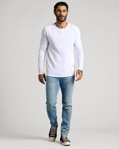 True ClassicMan wearing a White Waffle Long Sleeve Henley with jeans and sneakers.