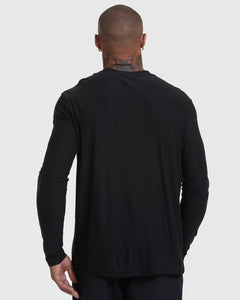True ClassicPerson wearing Standard Active Long Sleeve Crew T-Shirt in black, back view.