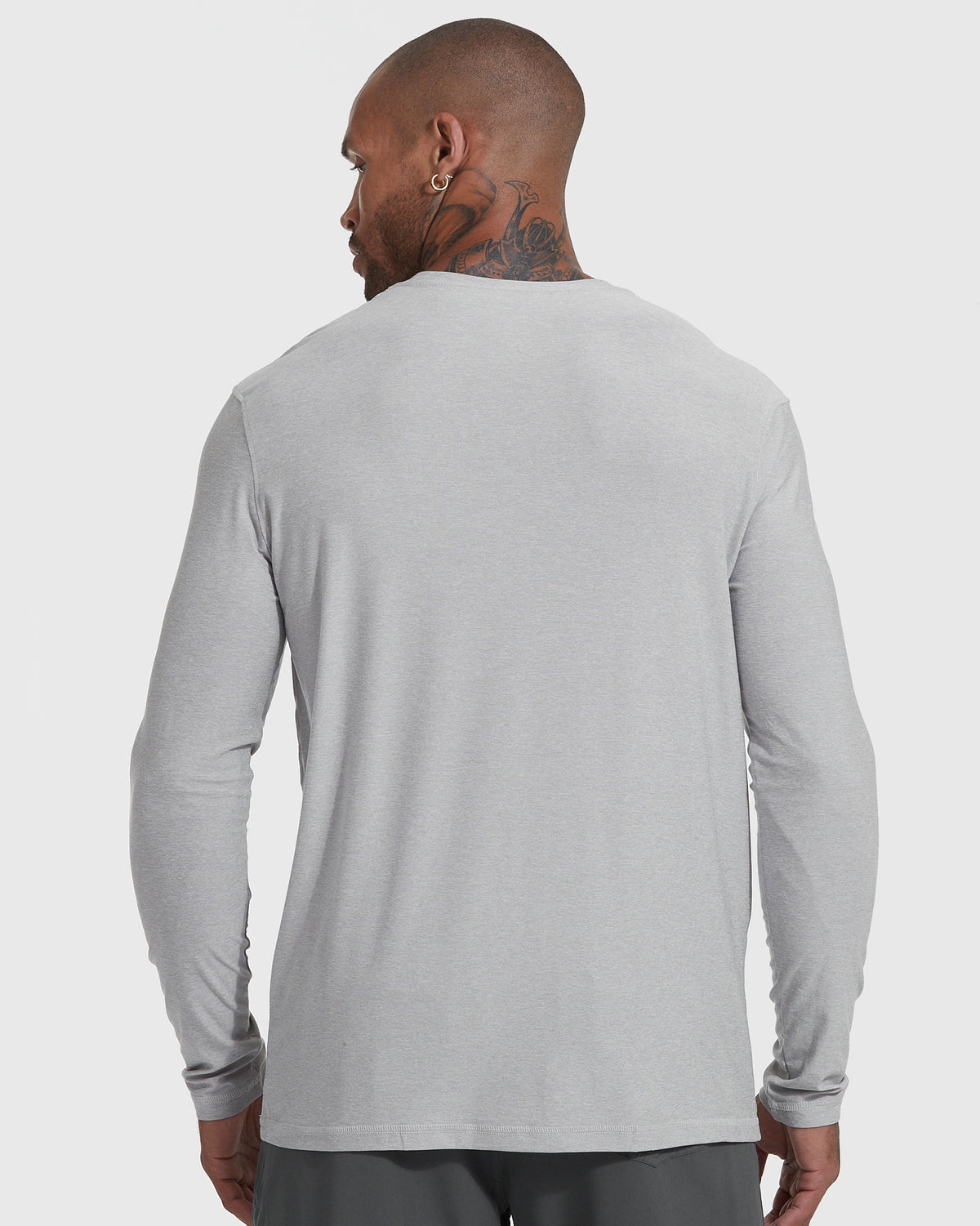 Man in Heather Light Gray Active Long Sleeve Crew T-Shirt, back view.